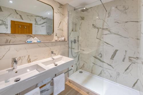 a bathroom with a sink and a shower at Harbour Hotel Fowey in Fowey