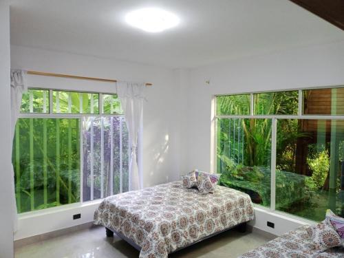 Postel nebo postele na pokoji v ubytování Relax in the Amazon, Tena