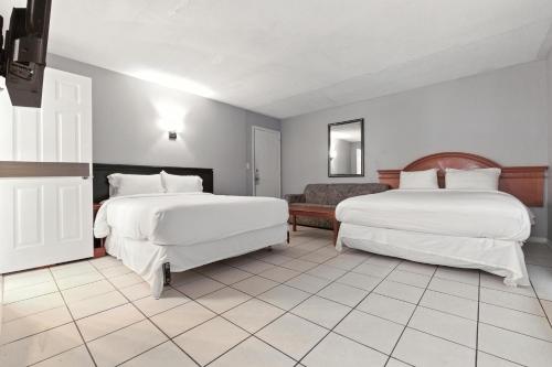 Postel nebo postele na pokoji v ubytování iCheck Inn Motel