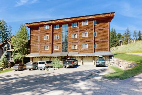 a large building with cars parked in a parking lot at Black Diamond #1B in Vista