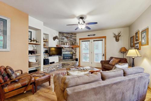 a living room with a couch and a tv at Black Diamond #1B in Vista