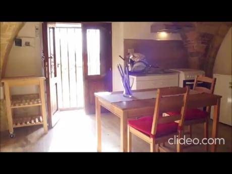 a dining room with a wooden table and chairs at Il Casolare in San Giovanni Teatino