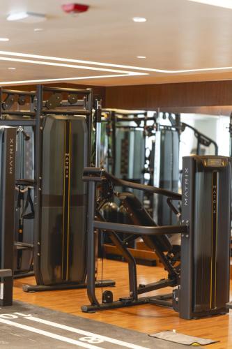 a gym with a bunch of equipment at Kertel Suites Kinshasa in Kinshasa