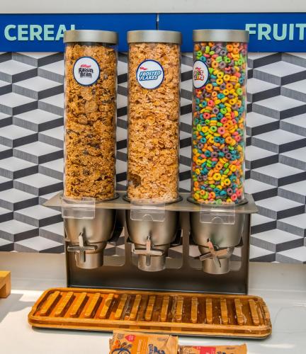 a shelf with three jars of granola at Holiday Inn Express Hotel & Suites Pittsburgh-South Side by IHG in Pittsburgh