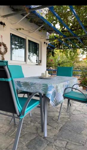 a table and chairs sitting on a patio at Vila Veta in Galatas