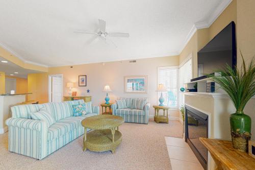 a living room with a couch and a tv at Condo 4100 #201 in Ocean City