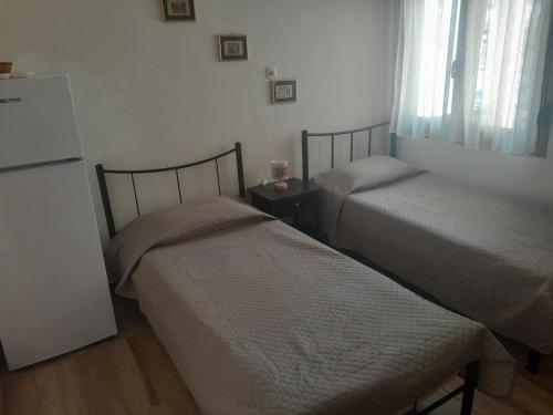 Postel nebo postele na pokoji v ubytování Studio Βασιλική Θανάσης