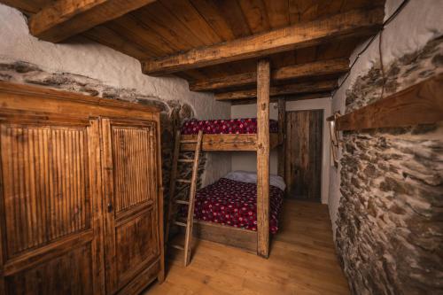 Postel nebo postele na pokoji v ubytování Rifugio Pra La Peira