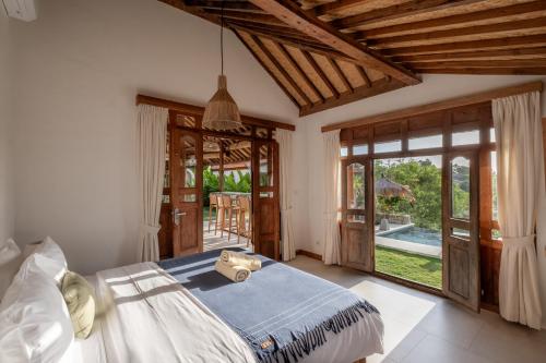 Ένα ή περισσότερα κρεβάτια σε δωμάτιο στο Villa Limasan Uluwatu