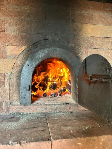 a large brick oven with a fire in it at Starry View in Funchal