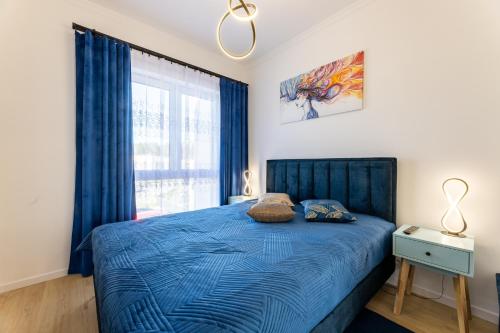 Katil atau katil-katil dalam bilik di Apartament Ustka Holiday - Black Alice z balkonem i klimatyzacją