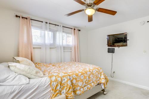 a bedroom with a bed and a ceiling fan at 10 Mi to Hartford Family Home with Yard in Manchester
