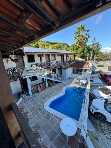 an aerial view of a house with a swimming pool at Pousada Mar de Porto in Porto Seguro