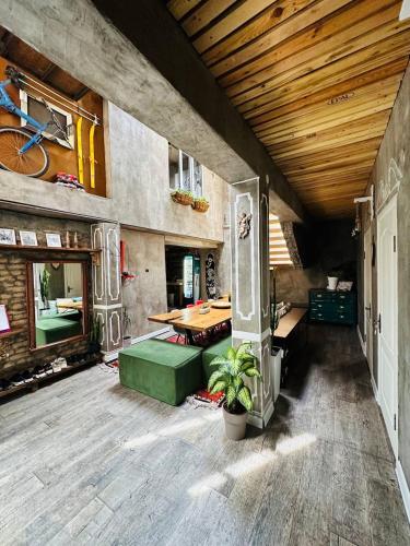 a room with a table and a bike on the wall at Sweet Home Art Boutique in Shymkent