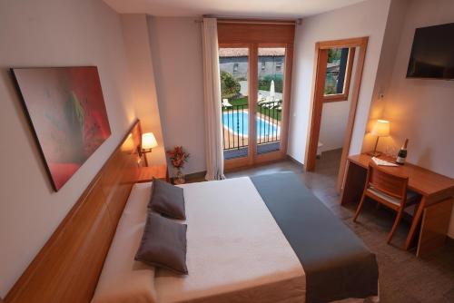 Posteľ alebo postele v izbe v ubytovaní Aparthotel Cal Marçal