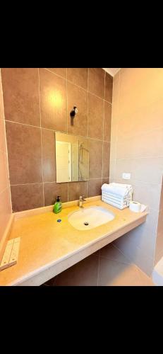 a bathroom with a sink and a mirror at Your Getaway to Adventure in Ain Sokhna