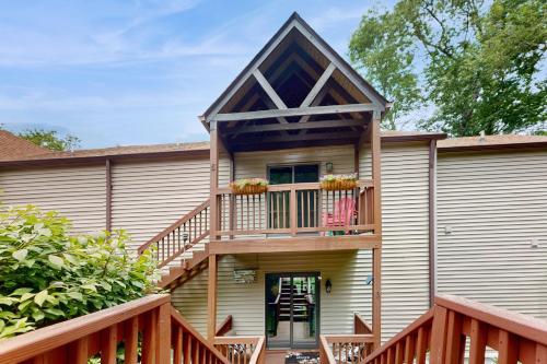 a house with a deck and a balcony at Misty Woods 03 in Sugar Mountain