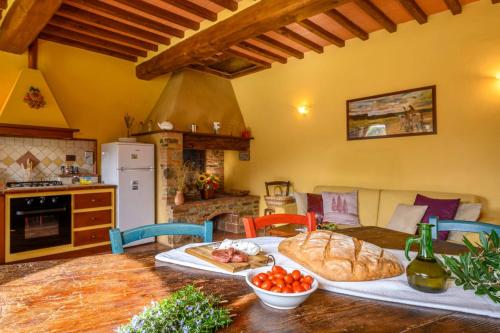 a kitchen with a table with some food on it at La Landuccia in Libbiano