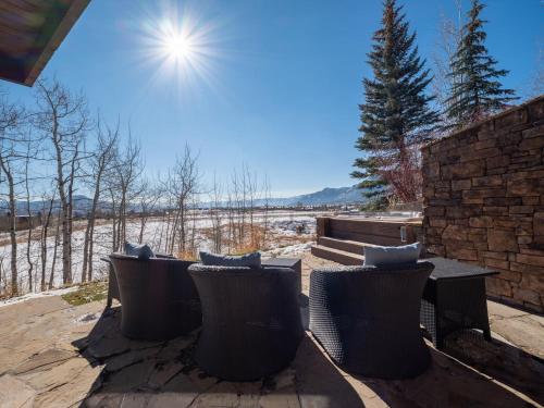 a group of chairs and a bench on a patio at RMR: Timbers at Granite Ridge 3098 in Teton Village in Teton Village