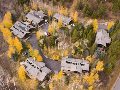 an aerial view of a house in the woods at RMR: Timbers at Granite Ridge 3100 in Teton Village in Teton Village