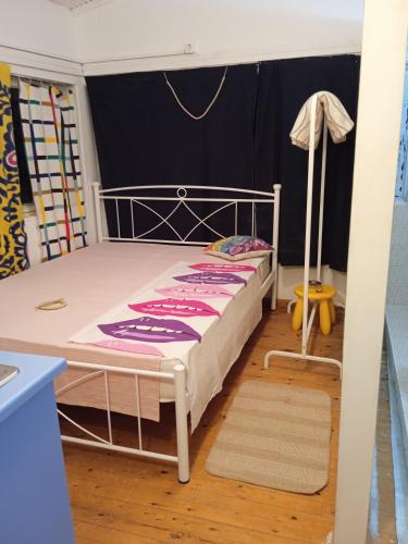 a bed in a room with a black wall at Chatue House Conte - ssiori in Agrafoí