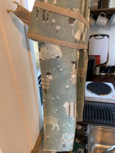 a bag with animals on the side of a refrigerator at Crabmill glamping bewdley in Bewdley