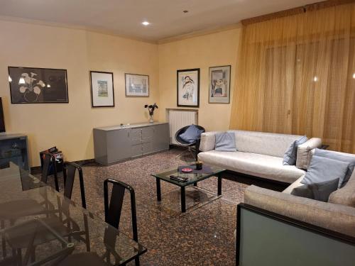 a living room with a couch and a table at Medusa Home & Relax in Porto SantʼElpidio