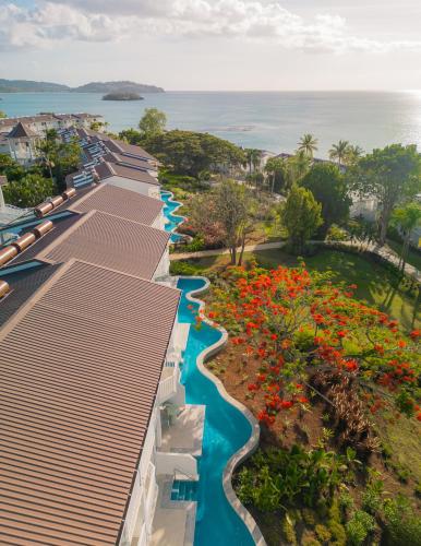 an aerial view of a resort with a river and flowers at Secrets Saint Lucia Resort & Spa - All Inclusive in Gros Islet
