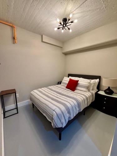 a bedroom with a bed with a ceiling fan at The Monarch Unit 8 in Huntsville