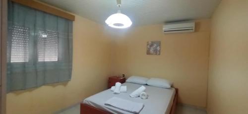 Postel nebo postele na pokoji v ubytování Gridia Apartment