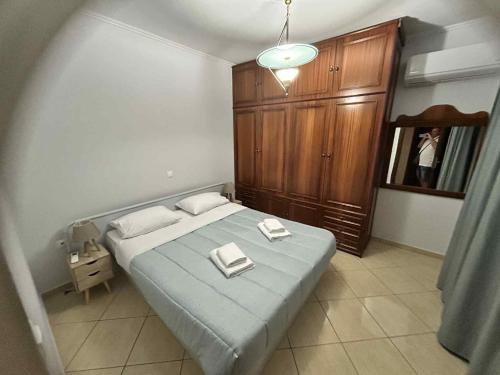 En eller flere senge i et værelse på Olympus Moments