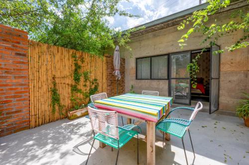 a colorful table and chairs on a patio at Concept House in Banda