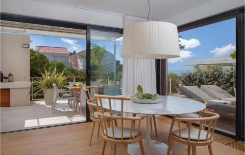 a dining room with a table and chairs at Villa Aster 3 in Sutivan