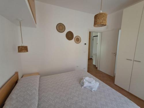 En eller flere senge i et værelse på Le Dune