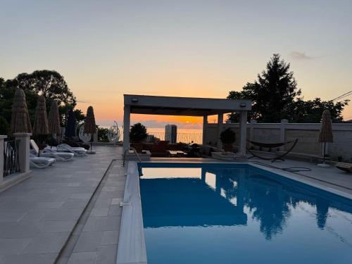 a swimming pool on the roof of a building at Villa Sunlight in Gonio