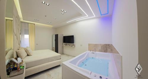 a bathroom with a tub in the middle of a room at SOPI Home in Castellammare di Stabia