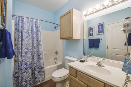 a bathroom with a sink and a toilet and a shower at Palm Bay 305 in Corpus Christi