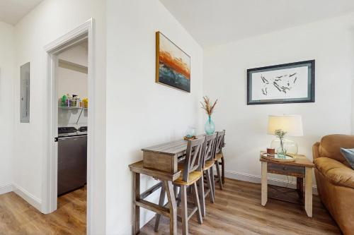 a living room with a table and a couch at Sunshine Shack in La Follette