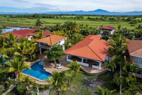 an aerial view of a resort with a swimming pool at Luxury Beachfront House with Pool in Palo Grande