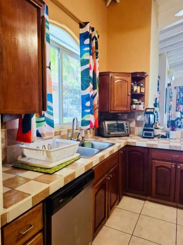a kitchen with a sink and a counter top at Luxury Beachfront House with Pool in Palo Grande