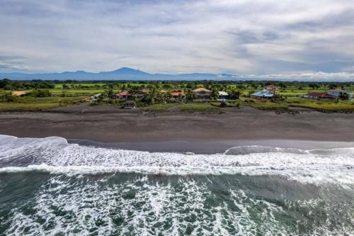 an aerial view of a beach with the ocean at Luxury Beachfront House with Pool in Palo Grande