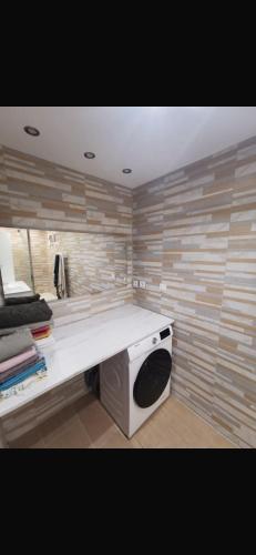 a kitchen with a stove and a white counter top at Chambre chez nous! Au calme, Montolivet proche métro in Marseille