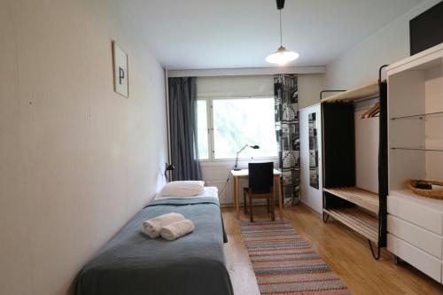 Ένα ή περισσότερα κρεβάτια σε δωμάτιο στο Convenient Apartment for 2