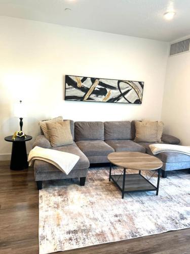 a living room with a couch and a table at Beehive Getaway in Salt Lake City