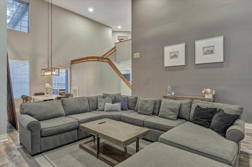a living room with a couch and a table at The Woodlands Gem with Pool and Spa in The Woodlands