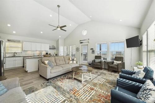 a living room with a couch and a table at Beachfront Views with 3 bedrooms and 2 bathrooms in Bolivar Peninsula