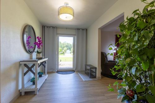 a room with a hallway with a mirror and a door at Turtle Time Retreat in Foley