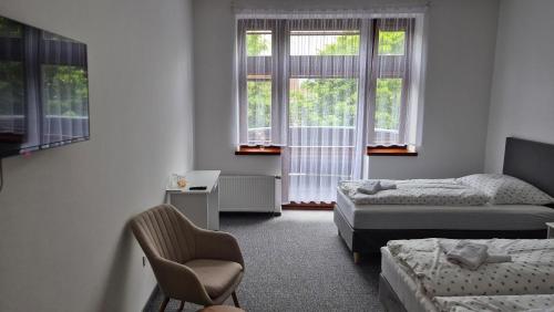 Ліжко або ліжка в номері Hotel Radnice Dobrovice