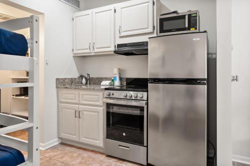 a kitchen with a stainless steel refrigerator and microwave at 514 Sunsuite in Fripp Island