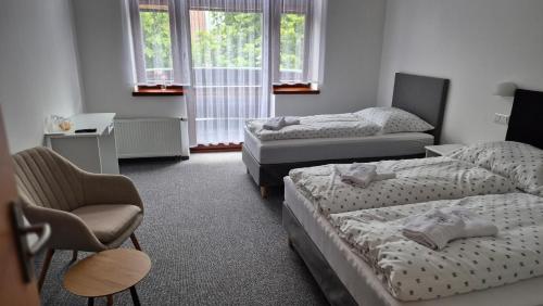 Cama o camas de una habitación en Hotel Radnice Dobrovice